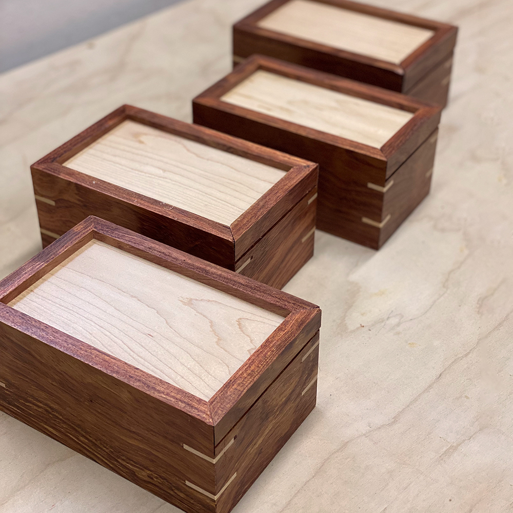 four gift boxes with sliding lids